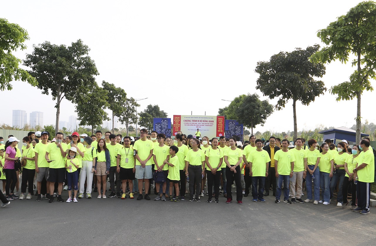A group of people in green shirtsDescription automatically generated with low confidence